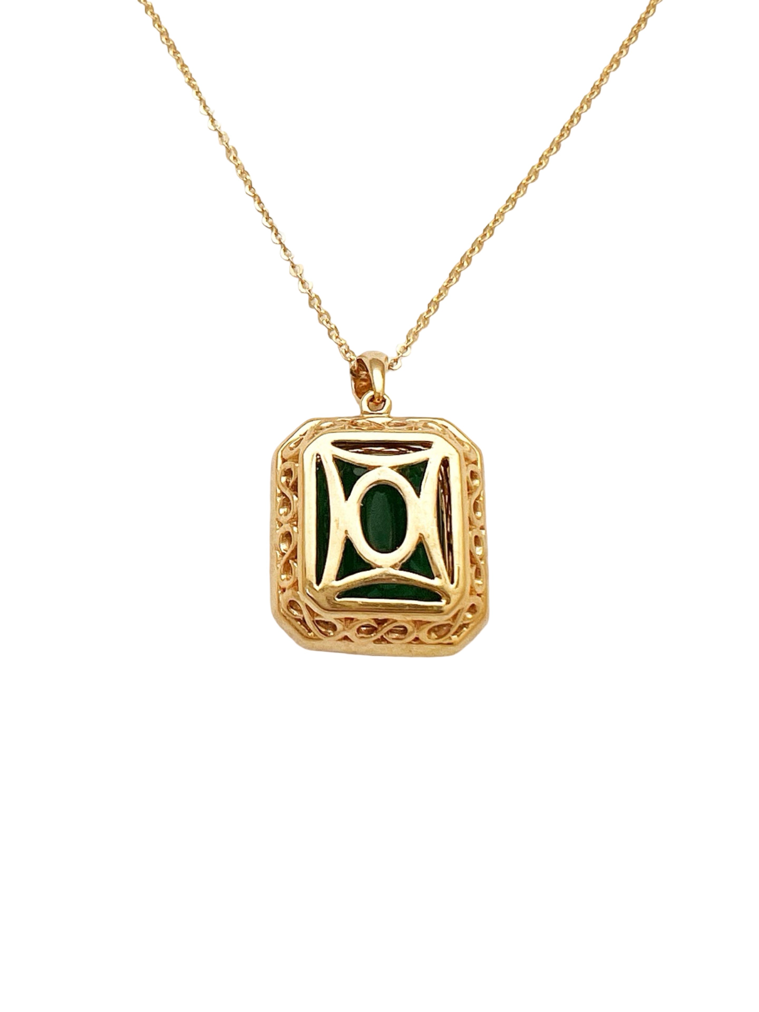 7.08 Carats Brazilian Emerald No-Oil (Certified) & 0.56 Carats Diamonds VS2 (34 melees) 3.6 Grams Set In 14 Karat Yellow Gold Pendant Includes 14 Karat Chain 18 Inches