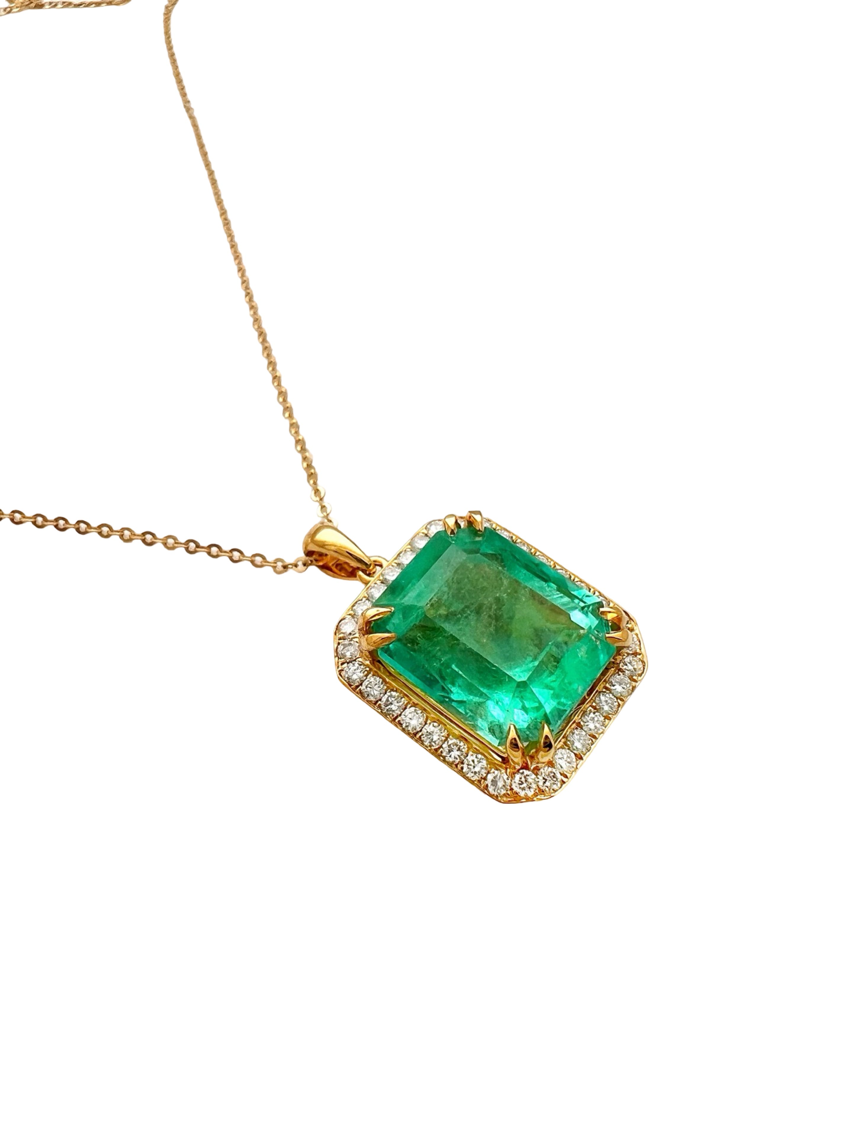 8.95 Carats Colombian Emerald F1 GIA (Certified) & 0.55 Carats Diamonds Set In 14 Karat Yellow Gold. Includes 14 Karat Dia-Cut Chain 18” Adjustable 16”