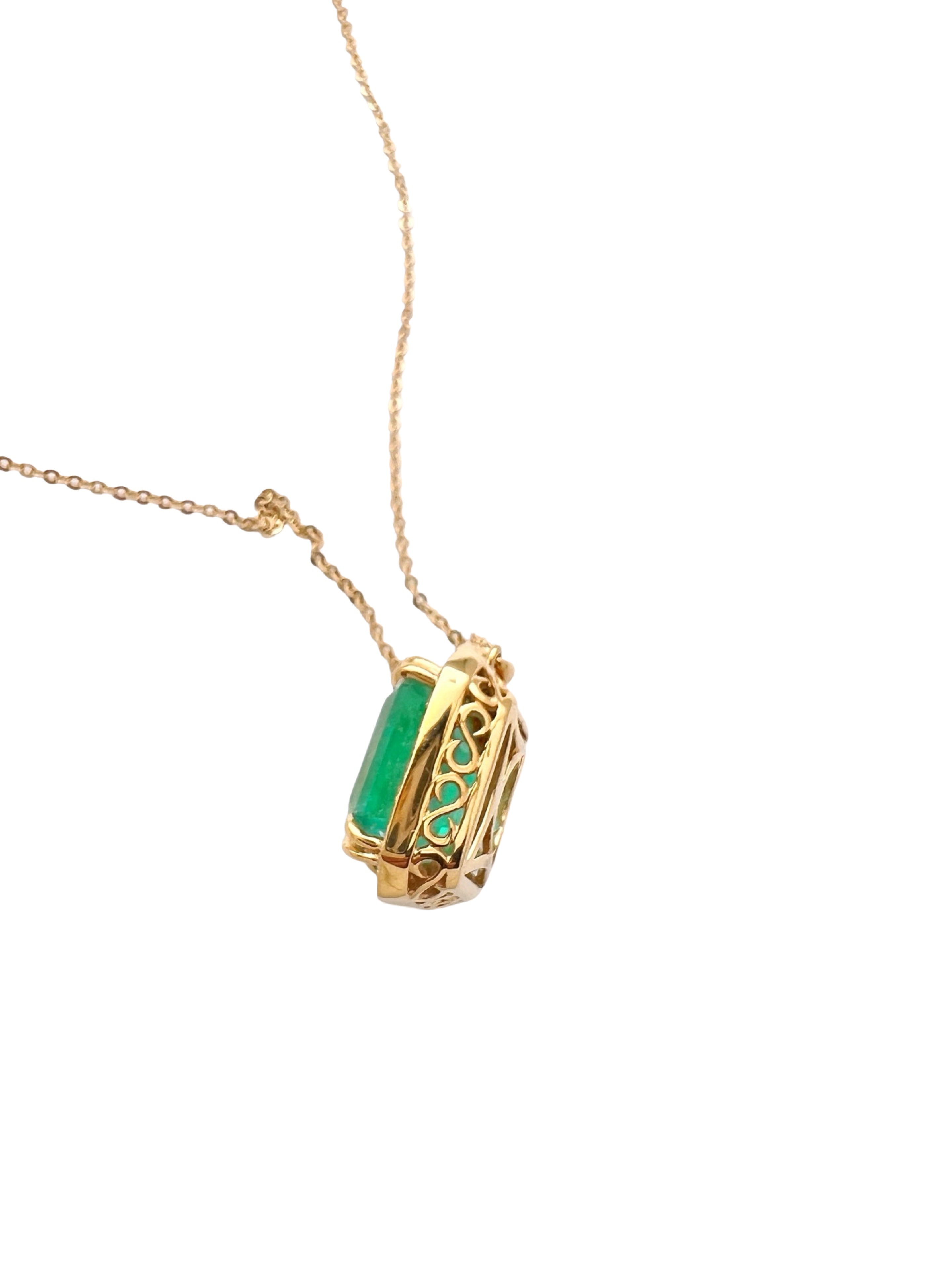 8.95 Carats Colombian Emerald F1 GIA (Certified) & 0.55 Carats Diamonds Set In 14 Karat Yellow Gold. Includes 14 Karat Dia-Cut Chain 18” Adjustable 16”