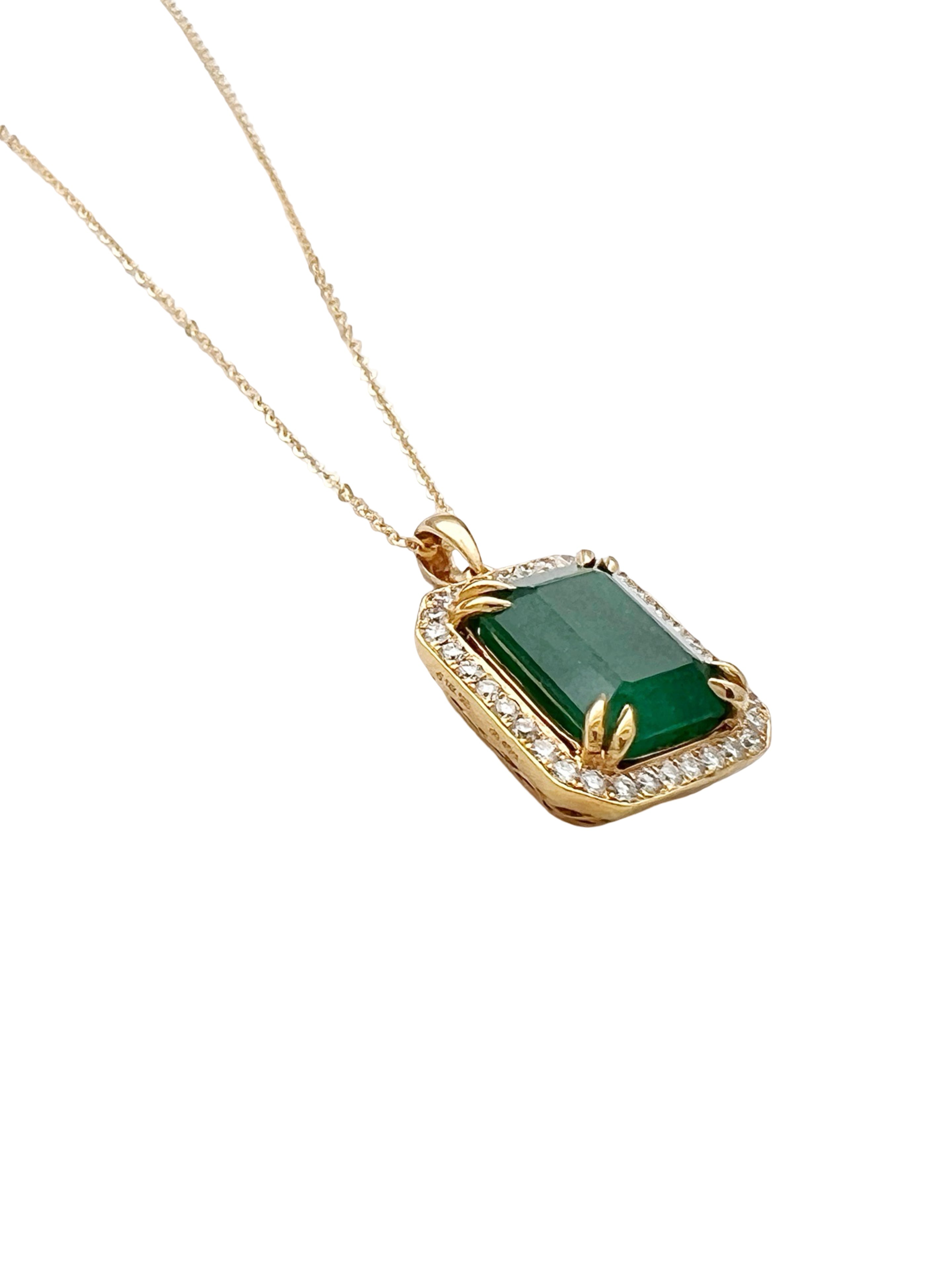 7.08 Carats Brazilian Emerald No-Oil (Certified) & 0.56 Carats Diamonds VS2 (34 melees) 3.6 Grams Set In 14 Karat Yellow Gold Pendant Includes 14 Karat Chain 18 Inches