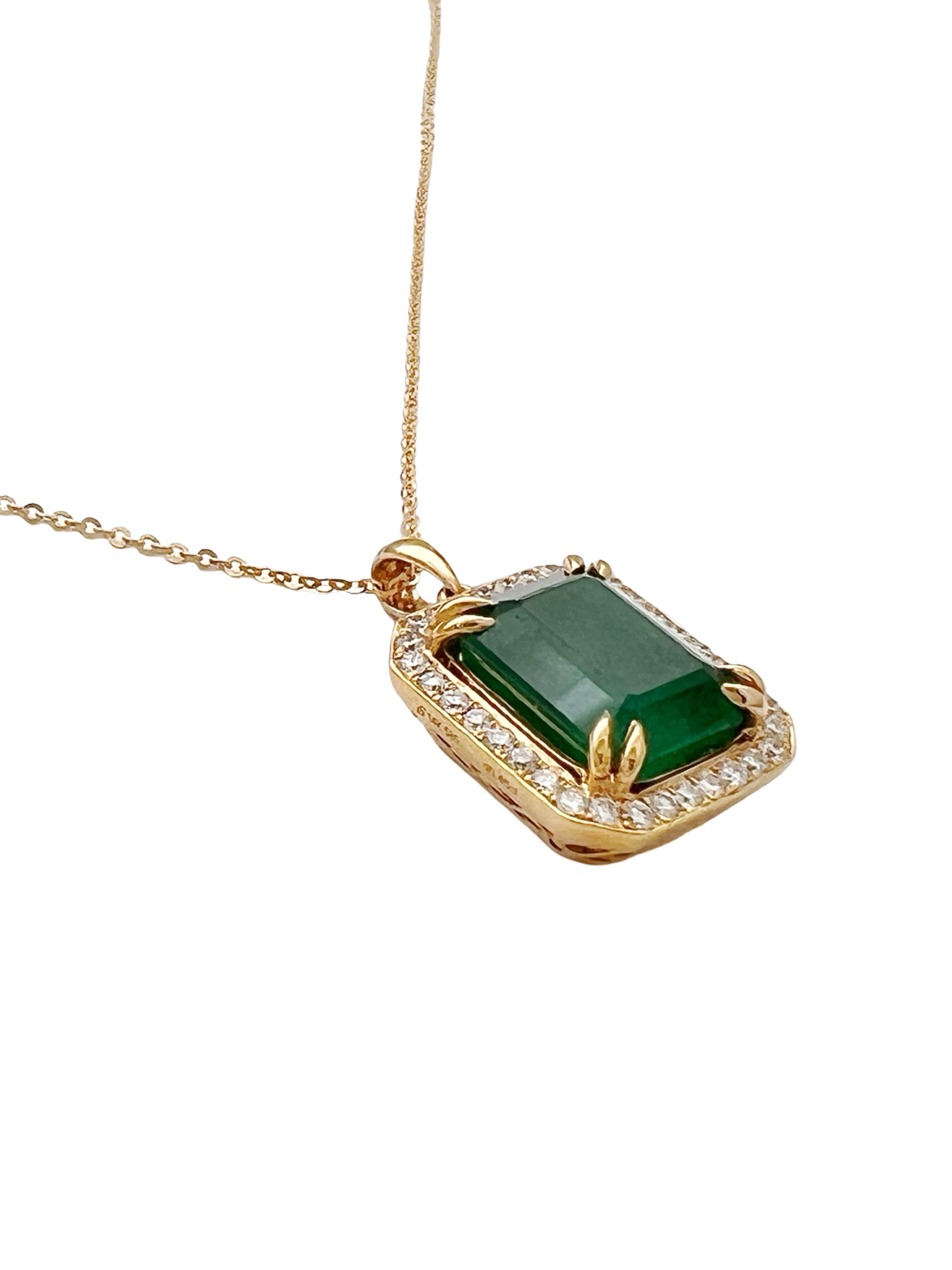 7.08 Carats Brazilian Emerald No-Oil (Certified) & 0.56 Carats Diamonds VS2 (34 melees) 3.6 Grams Set In 14 Karat Yellow Gold Pendant Includes 14 Karat Chain 18 Inches