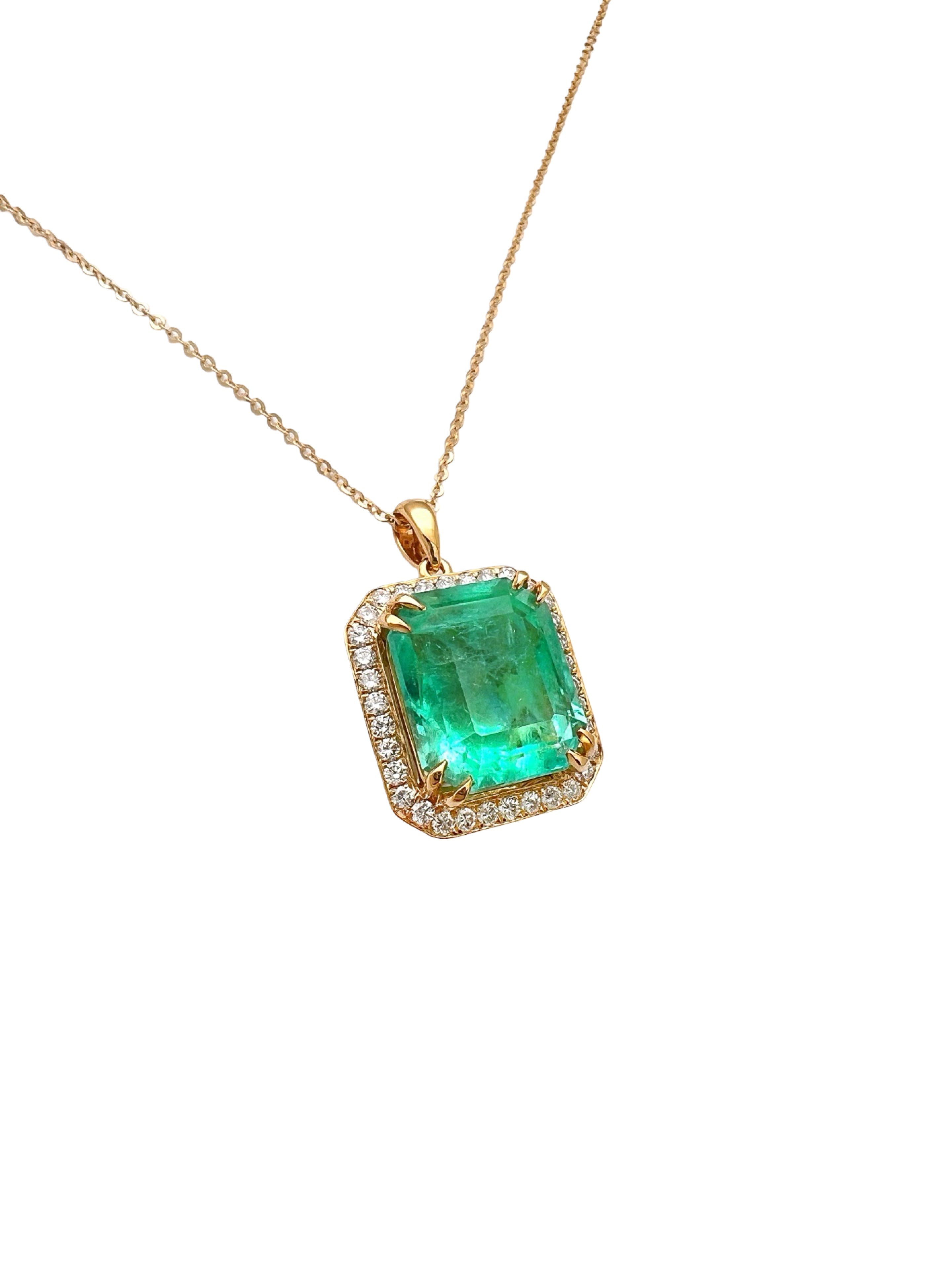 8.95 Carats Colombian Emerald F1 GIA (Certified) & 0.55 Carats Diamonds Set In 14 Karat Yellow Gold. Includes 14 Karat Dia-Cut Chain 18” Adjustable 16”