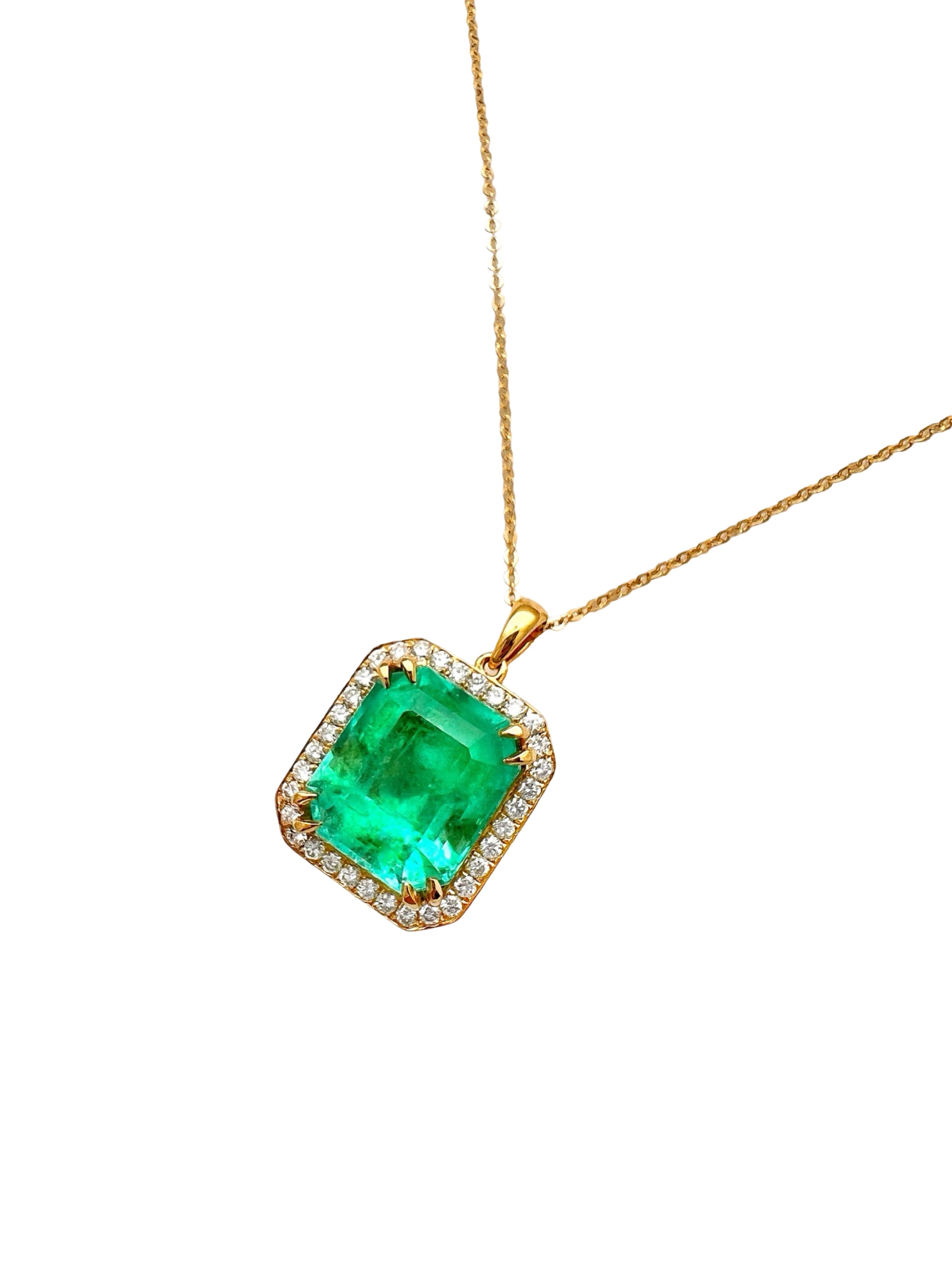 8.95 Carats Colombian Emerald F1 GIA (Certified) & 0.55 Carats Diamonds Set In 14 Karat Yellow Gold. Includes 14 Karat Dia-Cut Chain 18” Adjustable 16”