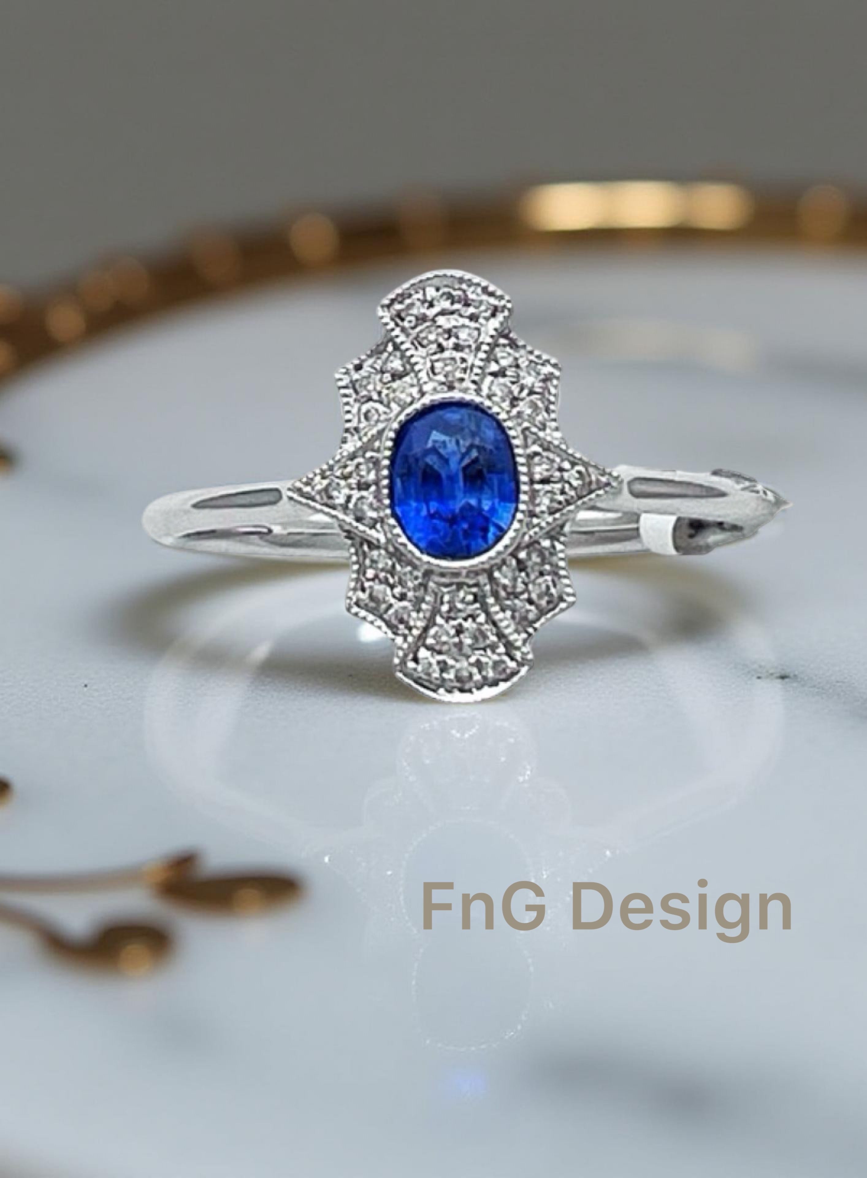 0.11 Carats Diamond VS2 & 0.57 Carats Blue Sapphire Set In 14 Karat White Gold Ring