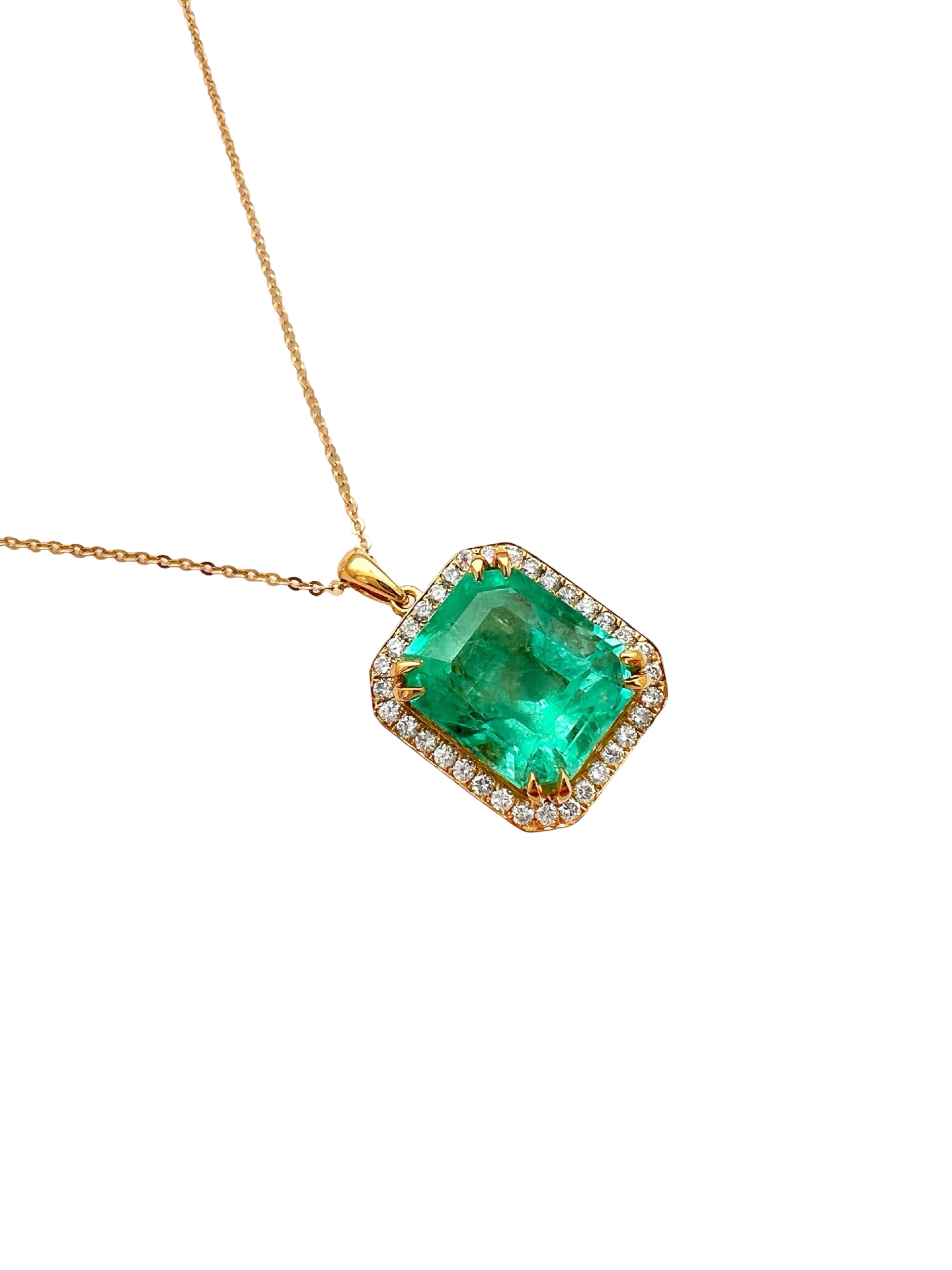 8.95 Carats Colombian Emerald F1 GIA (Certified) & 0.55 Carats Diamonds Set In 14 Karat Yellow Gold. Includes 14 Karat Dia-Cut Chain 18” Adjustable 16”