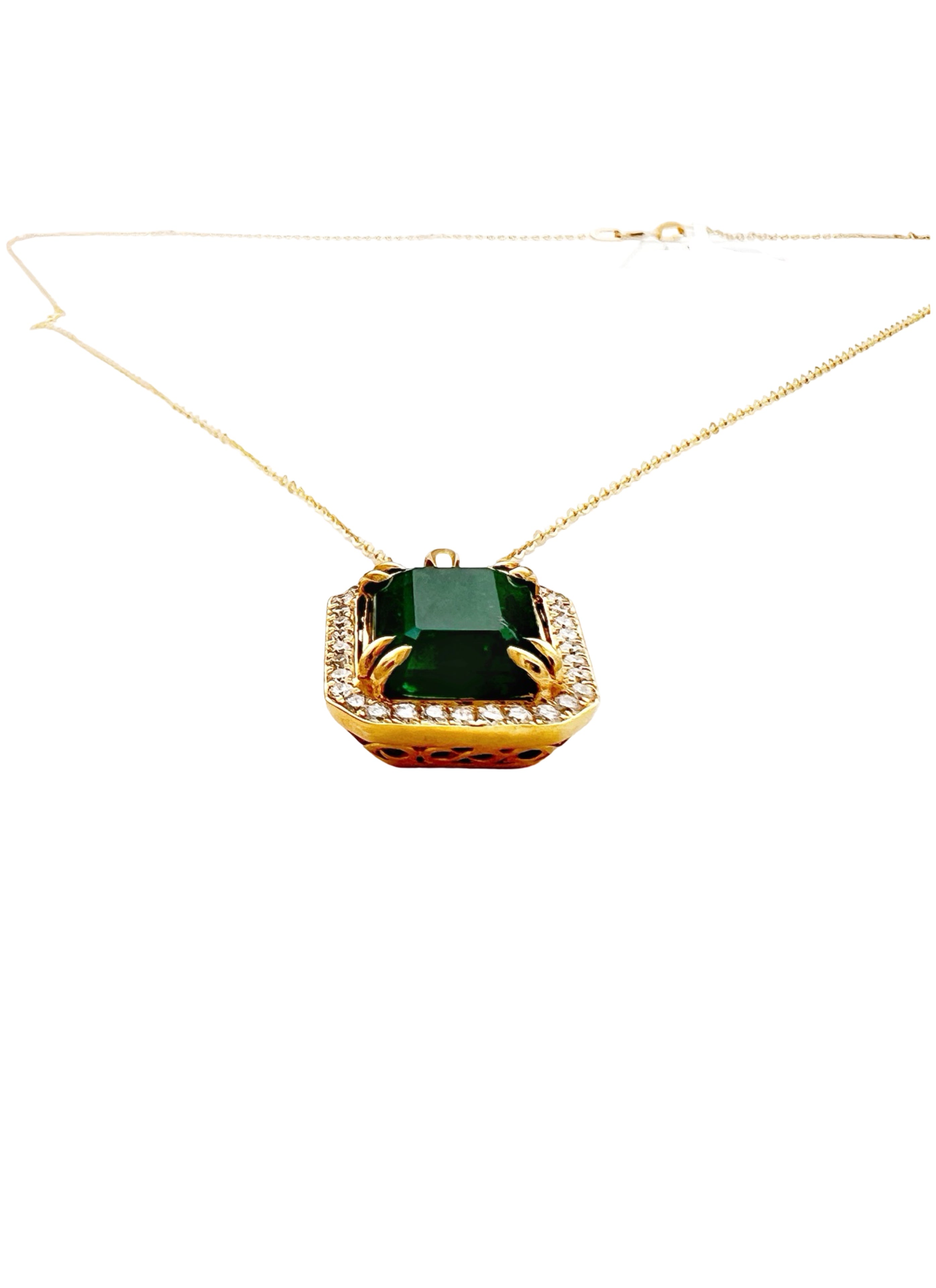 7.08 Carats Brazilian Emerald No-Oil (Certified) & 0.56 Carats Diamonds VS2 (34 melees) 3.6 Grams Set In 14 Karat Yellow Gold Pendant Includes 14 Karat Chain 18 Inches