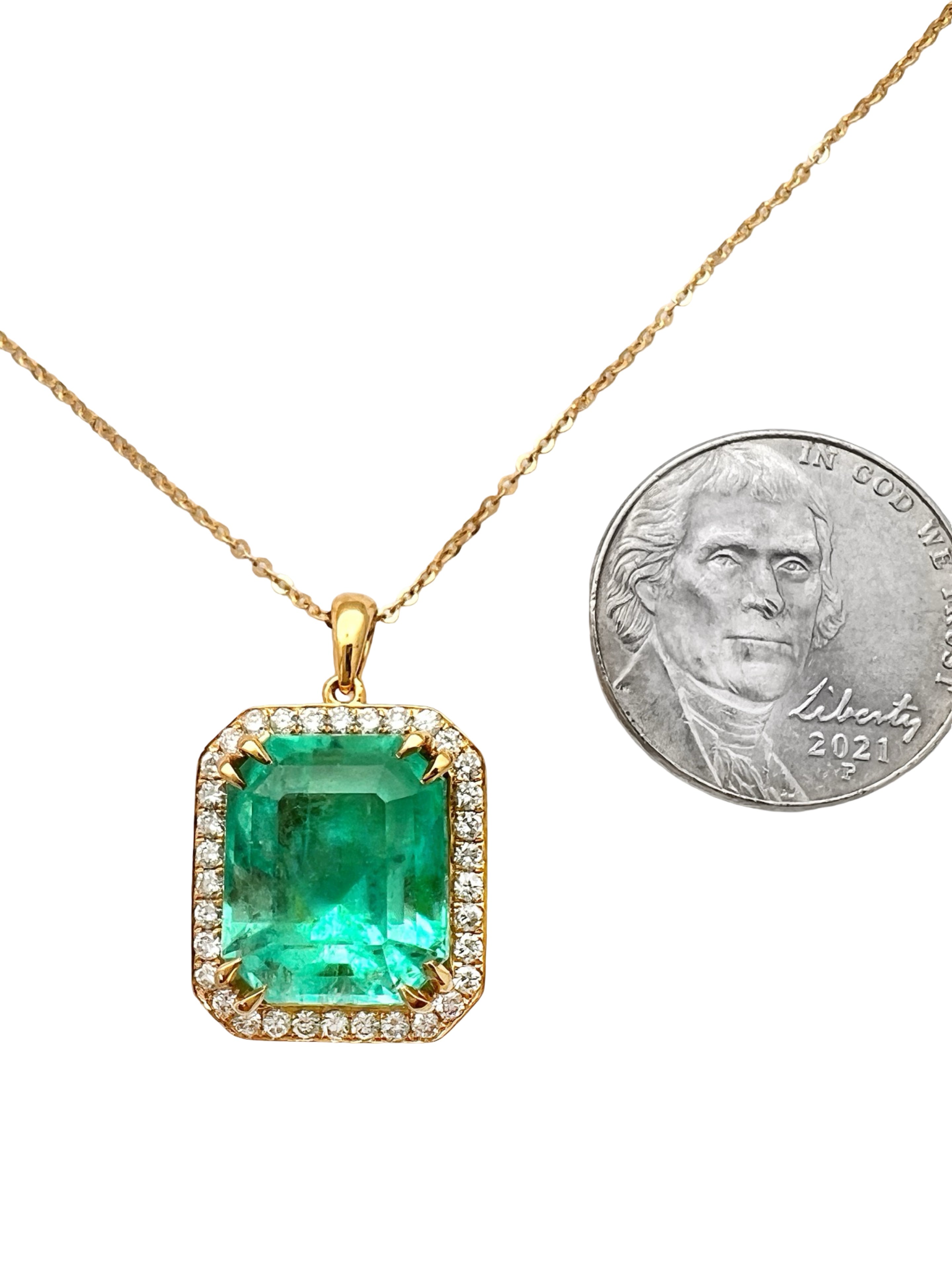 8.95 Carats Colombian Emerald F1 GIA (Certified) & 0.55 Carats Diamonds Set In 14 Karat Yellow Gold. Includes 14 Karat Dia-Cut Chain 18” Adjustable 16”